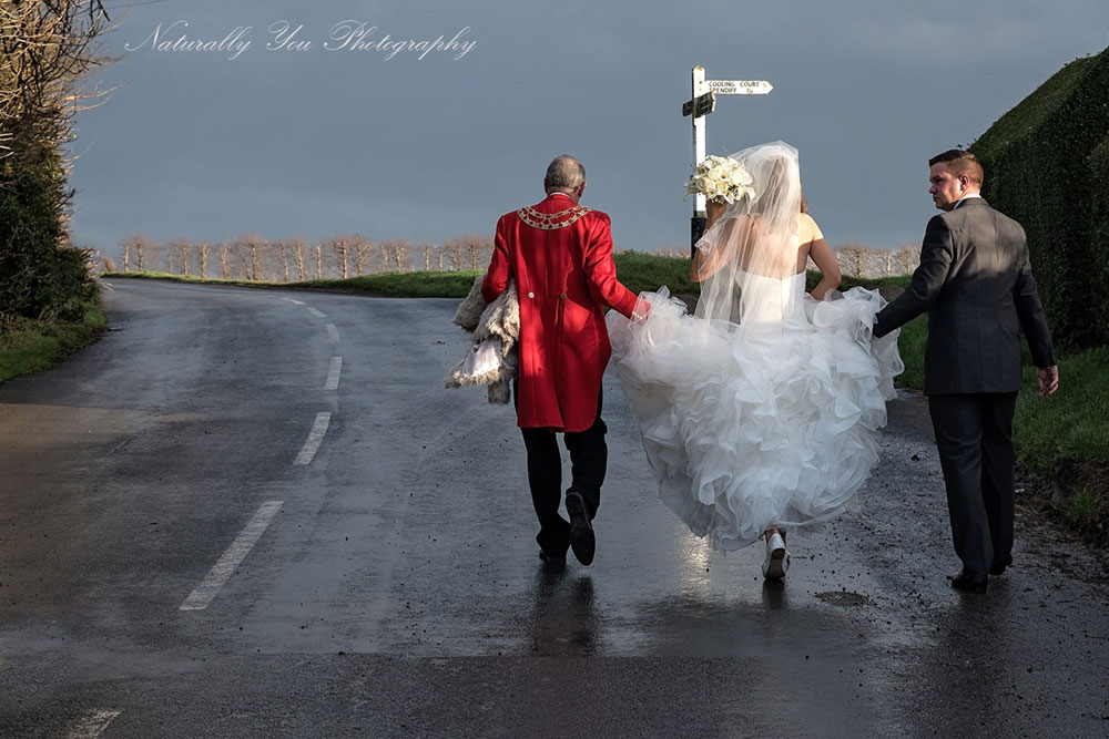 Toastmaster walking with Bride and Groom
