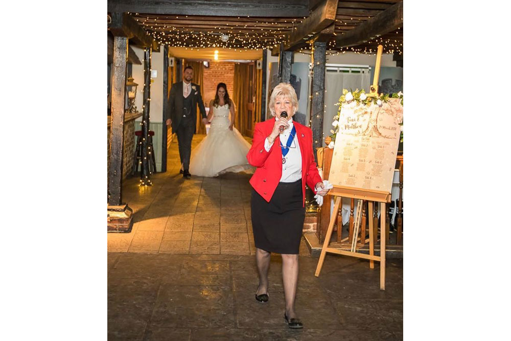 Lady Toastmaster announcing Bride and Groom
